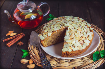 almond flour pound cake, gluten free and keto baking recipes,  decorated with sliced almonds
