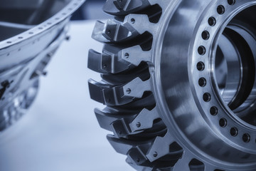 Jet engine gear wheels, industrial background.