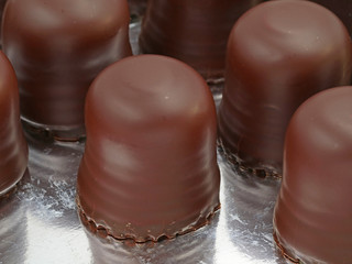 chocolate marshmallows in box, close up of unhealthy food