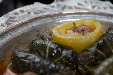 Eid Mubarak Traditional Ramadan Iftar dinner. Assorted tasty food in authentic rustic dishes on wooden table background.