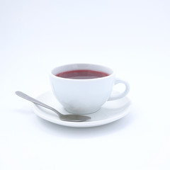 cup with tea and teapot on white  background, over light
