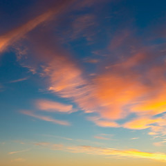 Fototapeta premium beautiful blue sky with golden clouds blurred by the wind as a natural background