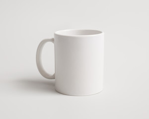 Template of a white mug on the white background