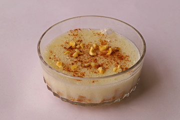 custard made with milk, cinnamon and hazelnut crumbs on it.