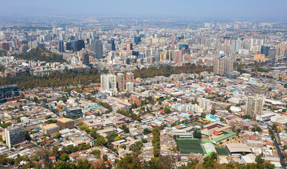Fototapeta na wymiar Santiago, Chile, View of the city from the San Cristobal hill. From the hill of San Cristobal opens an amazing panorama of Santiago - the city of St. James, the patron Saint of the Castilians, in who
