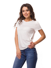 Obraz premium Beautiful woman in a t-shirt of white color. T-shirt template. She laughs and has fun 