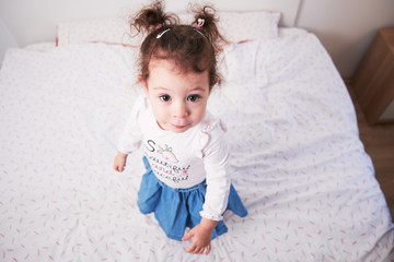 Fototapeta premium Innocent Little Girl with Big Eyes looking at camera