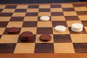 Checkers game with figures black and white