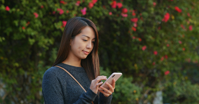 Woman use of mobile phont for check location