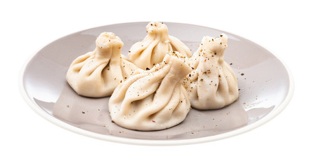 portion of khinkali on gray plate isolated
