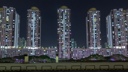 Aerial new estate with neighborhood faculties car park and green garden at the center of Singapore timelapse hyperlapse.