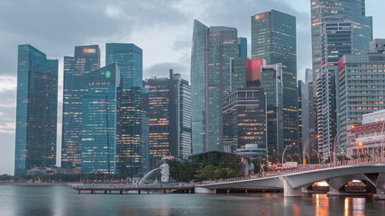 Esplanade bridge and downtown core skyscrapers in the background Singapore night to day timelapse