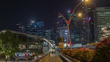 Fototapeta na wymiar Business Financial Downtown City and Skyscrapers Tower Building at Marina Bay night timelapse hyperlapse, Singapore