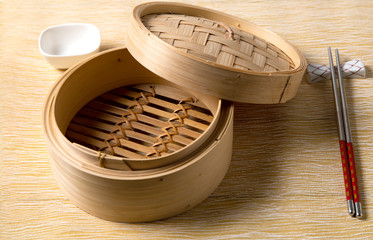Empty basket of dim sum made by bamboo material and chopsticks. Chinese Traditional cuisine...