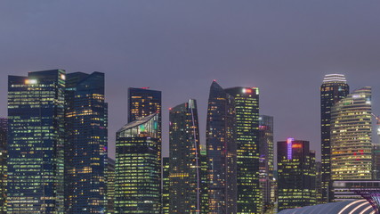 Business Financial Downtown City and Skyscrapers Tower Building at Marina Bay day to night timelapse, Singapore
