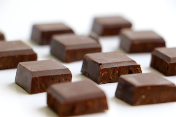 A pile of milk chocolate slab blocks broken up and stacked