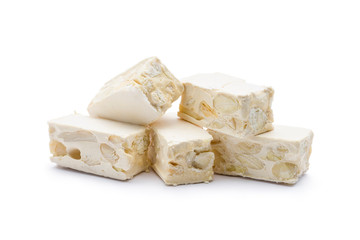 small nougat pieces on white background.