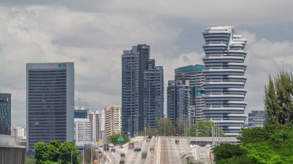 Traffic with cars on a street and urban scene in the central district of Singapore timelapse