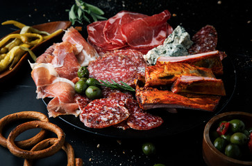 Italian snacks food  ham, prosciutto, salami, sausage, cheese and olives