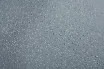 Roofing waterproofing, PVC membrane properties, close-up with water drops