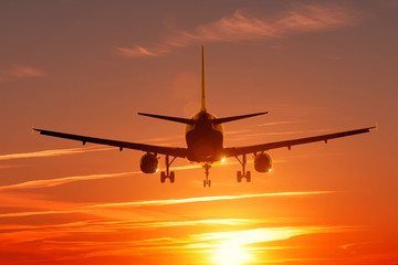 Fototapeta na wymiar Sunset view welkin scene with airplane silhouette.