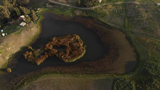 Wilcaocha, small lake in the peruvian andes, aerial shot. black lake, small village.