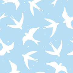Beautiful seamless pattern with silhouette swallow birds on the blue background. Perfect vector illustration.