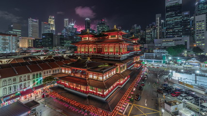 The Buddha Tooth Relic Temple comes alive at night timelapse in Singapore Chinatown, with the city...