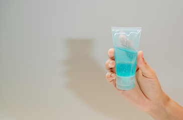 woman wipes her hands with an alcohol-based hand-washing spray. Preventive measures against coronavirus