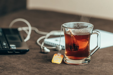Working from home with laptop notebook and tea cup