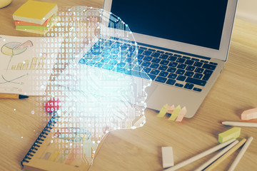 Multi exposure of work table with computer and brain hologram. Brainstorm concept.