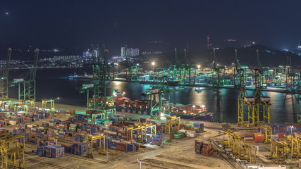 Naklejka premium Commercial port of Singapore aerial night timelapse.