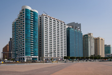 Fototapeta na wymiar Abu Dhabi Corniche beach and walking area with landmark view of modern buildings, UAE. May 2019