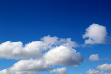 Naklejka na ściany i meble Bright sky with white clouds on a sunny day