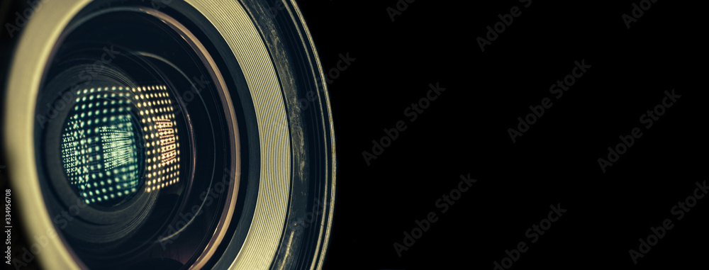 Aufkleber CLOSE UP Beautiful camera lens with light reflection on a black Background pattern for design..