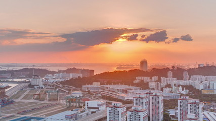 Sunset over commercial port of Singapore timelapse.