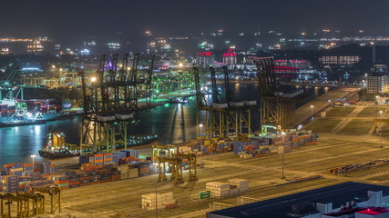 Fototapeta premium Commercial port of Singapore aerial night timelapse.