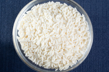 A top down view of a glass bowl of sticky rice