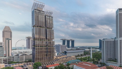 Evening panorama with Marina Bay area and skyscrapers city skyline aerial timelapse.