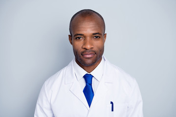 Photo of doctor practitioner handsome dark skin guy good mood friendly smiling to patients virologist wear white lab coat blue neck tie isolated grey color background