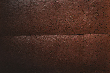 Top view above dark chocolate cake slices texture. 