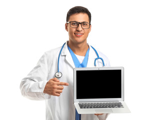 Handsome male doctor with laptop on white background