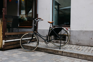 Old classic vintage  bicycle on the sidewalk