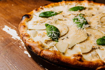 Delicious pizza with pear and blue cheese.