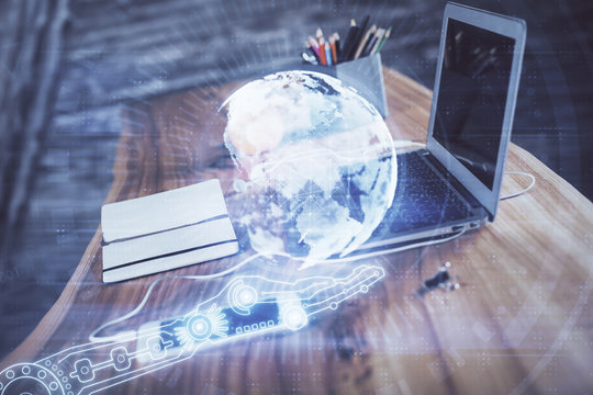 Multi exposure of table with computer and world map hologram. International data network concept.