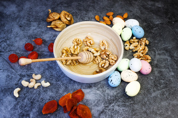 Still life, food and drink concept. Baking background with ingredients: sugar, flour, eggs, butter, spices for pie, easter cake, cookies on a grunge table. Selective focus, copy space, top view