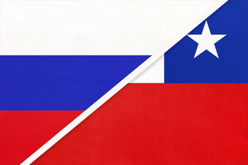 Russia vs Chile national flag from textile. Relationship and partnership between two countries.
