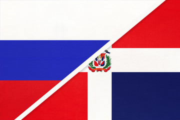 Russia vs Dominican Republic national flag from textile. Relationship and partnership between two countries.