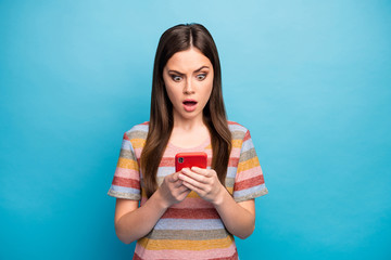 Close-up portrait of her she nice lovely worried mad irritated girl using device browsing smm feedback media isolated over bright vivid shine vibrant blue color background