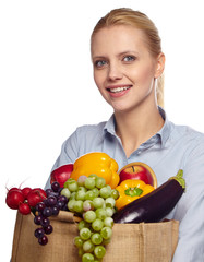 Woman holding grocery paper shopping bag full of fresh vegetables. Diet healthy eating concept isolated on a white background